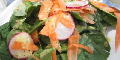 Salad drizzled with homemade dressing